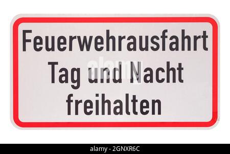 German traffic sign isolated over white background. Feuerwehrausfahrt Tag und Nacht freihalten (translation: Fire department exit, keep clear day and Stock Photo