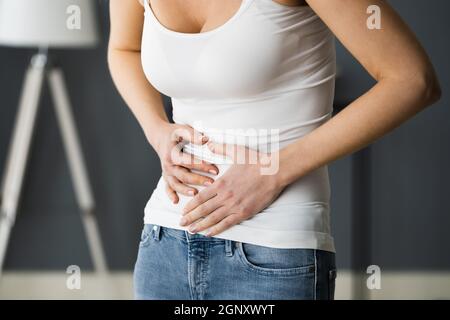 Incontinence, Constipation, Menopause Or PMS Stomach Pain Stock Photo