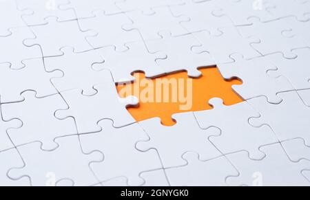Empty white jigsaw puzzle with  missing pieces Stock Photo