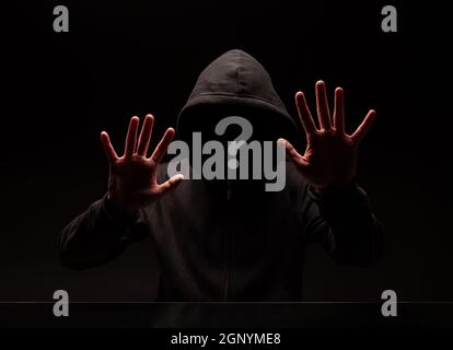 Question mark face, mysterious man wearing a hood does not see his face Stock Photo