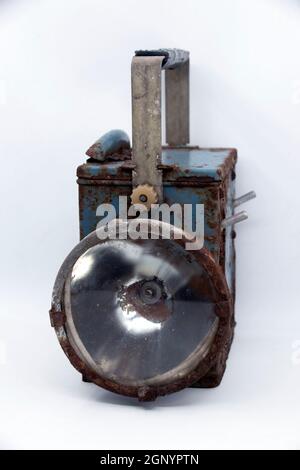 Old rusty blue railway lantern on white background. Stock Photo