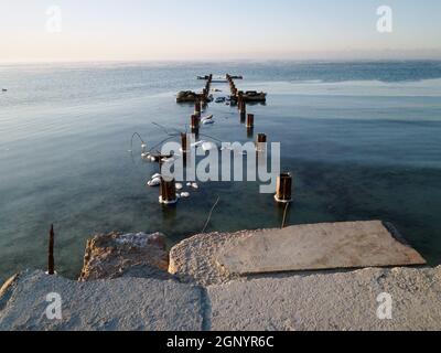 Old concrete pier Caspian Sea. Kazakhstan. Mangistau region. Aktau city. 22 November 2019 year. Stock Photo