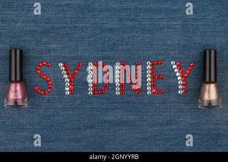 Word Sydney, made of rhinestones, encrusted on denim. World Fashion. View from above Stock Photo