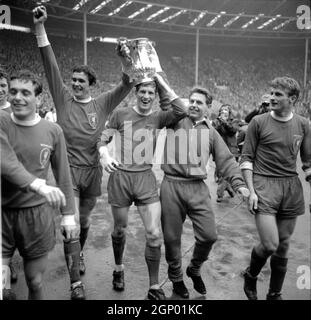 File photo dated 01-05-1965 of (L-R) Liverpool's Ian Callaghan, Ron Yeats, Wilf Stevenson, Gordon Milne and Roger Hunt parade the FA Cup around Wembley after their 2-1 win. Issue date: Tuesday September 28, 2021. Stock Photo