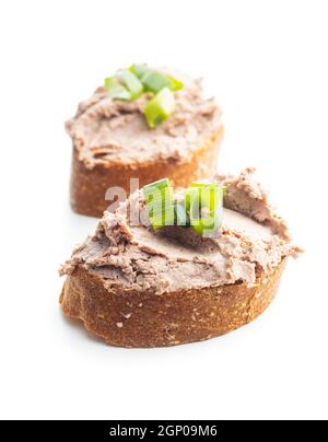 Liver pate on sliced baguette. Stock Photo