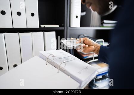 Stealing Trade Secret. Taking Photo Using Phone Stock Photo