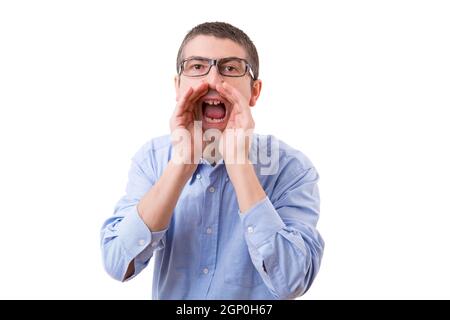 Young business man screaming at you, isolated over white background Stock Photo