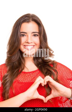 Beautiful woman making a heart shape with her hands, isolated over white background Stock Photo