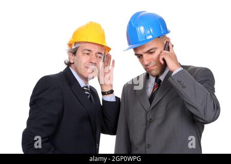 Two Engineers or Architects, on the phone, isolated in white background Stock Photo