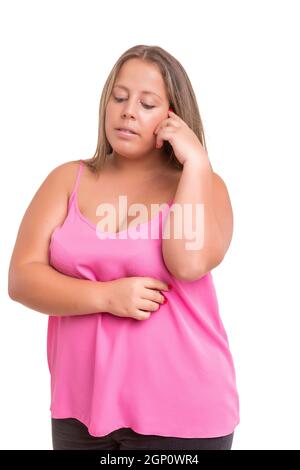 Large woman worried about her weight, isolated over white Stock Photo