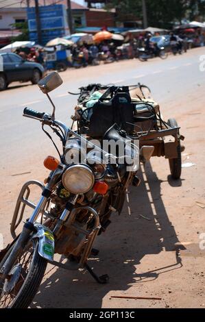 Retro vintage old motorcycle of Cambodian people riding service carry goods product in Poipet border crossing and Aranyaprathet at Sa Kaeo of Thailand Stock Photo