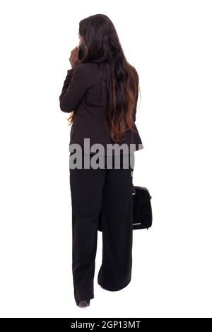 Back view of young african businesswoman holding briefcase isolated on white background Stock Photo