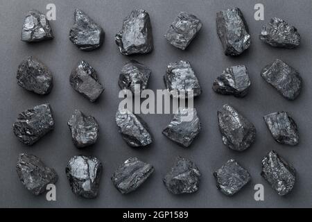 Coal lumps over black background. Top view Stock Photo