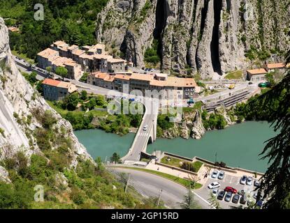 View From The Fortress Of Sisteron Down To A Bridge Crossing The Green Shimmering River Durance In France On A Beautiful Spring Day Stock Photo