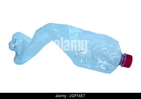 Close up of a plastic bottle isolated on white background. Recycling concept. Used plastic bottle crushed and crumpled against on the white background. Stock Photo