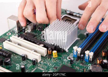 Computer engineer working on an old motherboard Stock Photo