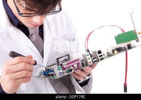 Computer engineer working on an old motherboard Stock Photo