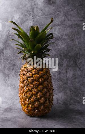 Pineapple isolated on dark background with copy space. Stock Photo