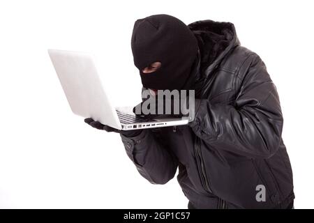 Disguised computer hacker Stock Photo