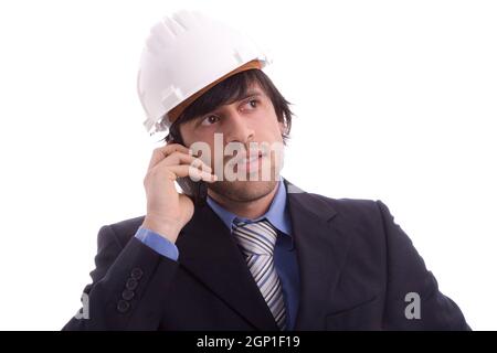Young engineer on the phone, isolated on white Stock Photo