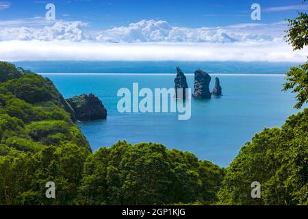 Three Brothers Rocks in the Avacha Bay of the Pacific Ocean. The coast of Kamchatka Stock Photo