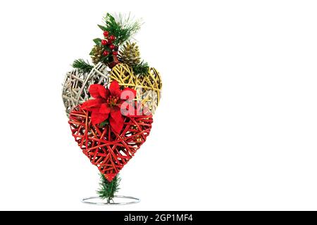 Red, Gold ,Silver wicker hearts, single poinsettia flower fir cones and red berries isolated on white Stock Photo