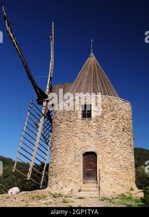 Close Up Of The Ancient Windmill Moulin Saint Roch In The Hills Of Grimaud In Provence France On A Beautiful Autumn Day With A Clear Blue Sky Stock Photo