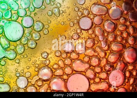 Colorful abstract macro background with oil drops in water Stock Photo