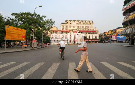 Hanoi, Vietnam - Oct 3, 2013. Activities on street of Hanoi Downtown (Pho Co). Hanoi, located on the banks of the Red River, is one of the most ancien Stock Photo