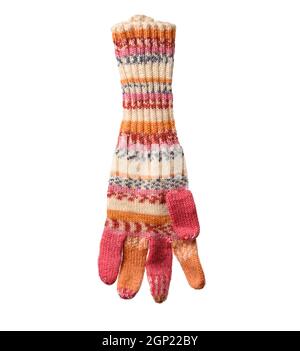 knitted woolen mitten from multi-colored threads, isolated on white background, close up Stock Photo