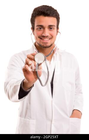 Handsome young medic holding a stethoscope, isolated over white Stock Photo