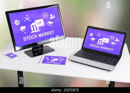 Stock market concept shown on different information technology devices Stock Photo