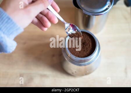 Preparing coffee: Close up of coffee powder in a vintage coffee cooker Stock Photo