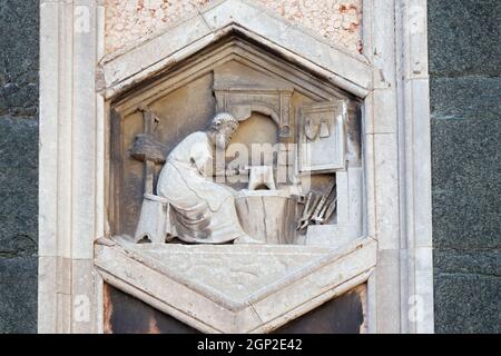 Tubalcain by Nino Pisano, 1334-36., Relief on Giotto Campanile of Cattedrale di Santa Maria del Fiore (Cathedral of Saint Mary of the Flower), Florenc Stock Photo