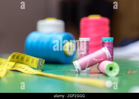 Seamstress measuring tape. working on textile industry fabric close up.  Unrecognizable person Stock Photo - Alamy