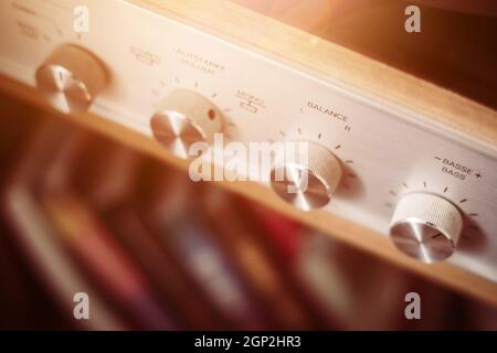 Control knops of silver wooden vintage amplifier, closeup Stock Photo