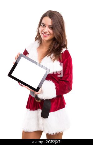 Young woman dress in Christmas costume, presenting your product Stock Photo