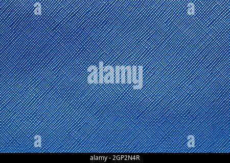 Seamless plastic texture background. Close-up of a detail from a blue surface of a cosmetic bag. Beautiful backdrop. Macro. Stock Photo