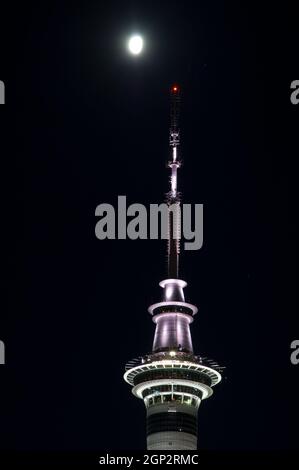 Sky Tower and moon. Auckland. North Island. New Zealand. Stock Photo