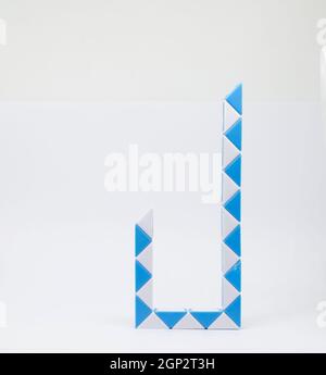 Letter "j" made of and white triangles on a white background. Stock Photo