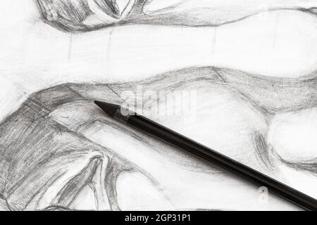 top view of set of black graphite pencils on hand-drawn academic