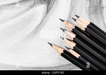 top view of set of black graphite pencils on hand-drawn academic drawing close up Stock Photo