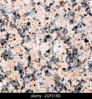 square background from polished slab of natural pink granite Stock Photo