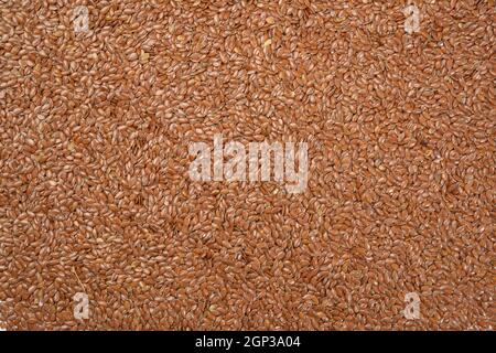 texture of dry brown flax seeds, top view, full frame Stock Photo
