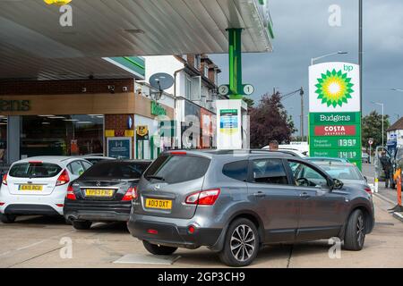 Slough, UK. 28th September, 2021. It was busy at the BP petrol station on the Farnham Road at Slough. Unleaded petrol was available but not diesel. Panic buying of petrol and diesel has continued over the past few days due to a shortage of drivers making fuel deliveries following Brexit and the Covid-19 Pandemic. Credit: Maureen McLean/Alamy Live News Stock Photo