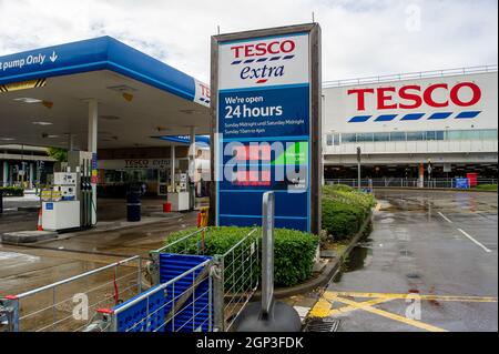 Slough, UK. 28th September, 2021. The Tesco petrol station on the A4 in Slough was barried off and closed today due to a shortage of both petrol and diesel. Panic buying of petrol and diesel has continued over the past few days due to a shortage of drivers making fuel deliveries following Brexit and the Covid-19 Pandemic. Credit: Maureen McLean/Alamy Live News Stock Photo
