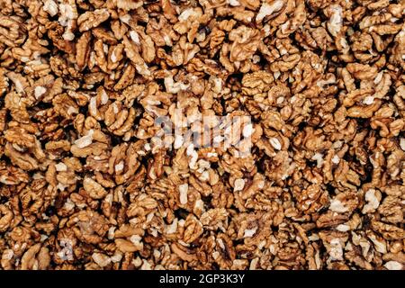 Closeup of big shelled walnuts pile. The background of their shelled walnuts. Stock Photo