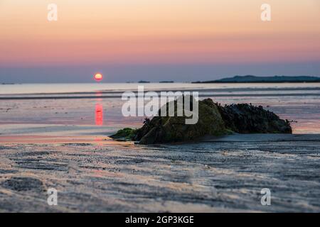 Sunset on beach ,Anglesey west coast near Rhosneigr, Wales,UK Stock Photo