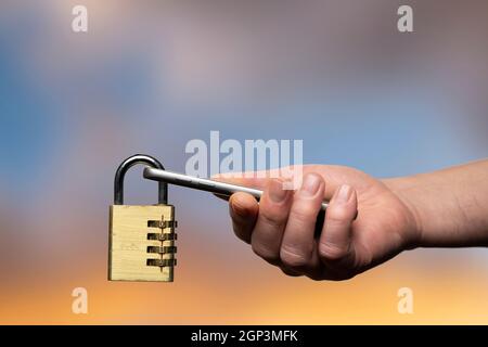 a mobile phone in hand with a padlock. Concept of data protection on mobile devices Stock Photo