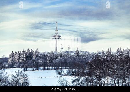 View to Hoherodskopf in beautiful landscape with snow in Hesse Germany Stock Photo